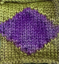 a knitted square with a purple and yellow diamond